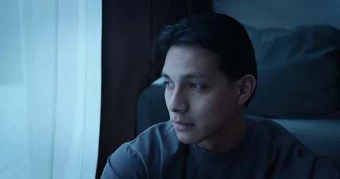 Depressed man look out window feel sorrow and stress. Sad young guy. Vidéo 338011319
