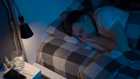 Depressed man lying in bed cannot sleep from insomnia. Young male trying to Stock Footage 145439961