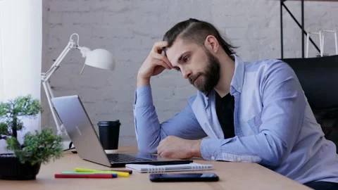Depressed man overworked on laptop computer. Stressed worker recieved bad online Stock-Footage 166099380