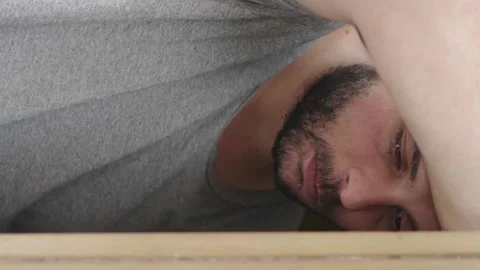Depressed man resting his head on the window Stock Footage 279174331