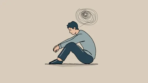 Depressed man sitting on the ground in a side view, with his hands resting .. Stock Footage 305571084