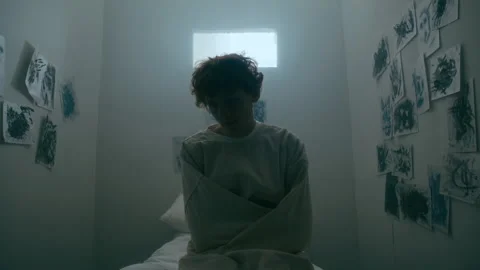Depressed Man in Straitjacket Sitting in Seclusion Room at Psychiatric Hospital Stock Footage 313251022