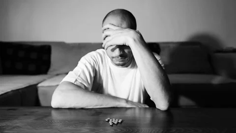 Depressed man suffering suicidal depression want to commit suicide by overdose 스톡 동영상 111361316