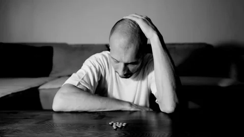 Depressed man suffering suicidal depression want to commit suicide by overdose 스톡 동영상 111361363