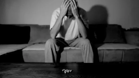 Depressed man suffering suicidal depression want to commit suicide by overdose 스톡 동영상 111361364