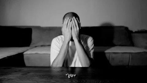 Depressed man suffering suicidal depression want to commit suicide by overdose 스톡 동영상 111361377