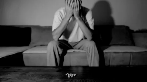 Depressed man suffering suicidal depression want to commit suicide by overdose 스톡 동영상 111361381