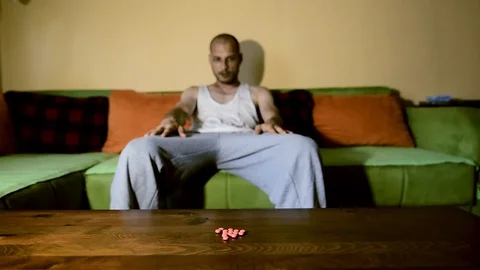 Depressed man suffering from suicidal depression want to commit suicide overdose Stock Footage 111644835