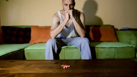 Depressed man suffering from suicidal depression want to commit suicide overdose 스톡 동영상 111644841
