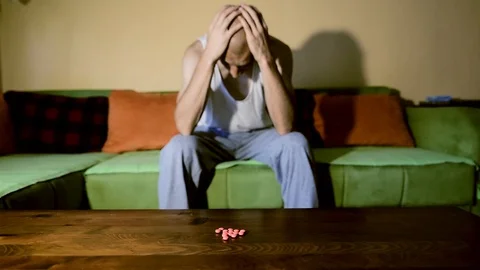 Depressed man suffering from suicidal depression want to commit suicide overdose 스톡 동영상 111644858