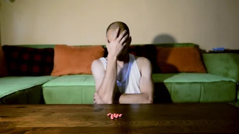 Depressed man suffering from suicidal depression want to commit suicide overdose 스톡 동영상 111644943