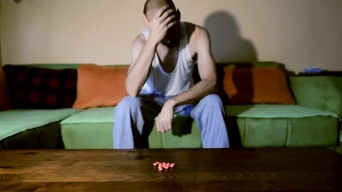 Depressed man suffering from suicidal depression want to commit suicide overdose 스톡 동영상 111644958