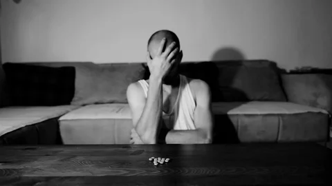 Depressed man suffering suicidal depression want to commit suicide by overdose 스톡 동영상 112013294