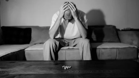 Depressed man suffering suicidal depression want to commit suicide by overdose 스톡 동영상 112013387