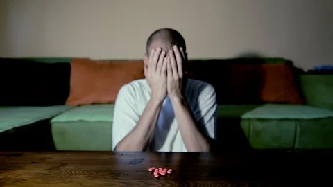 Depressed man suicidal depression commit suicide strong medicament drugs pills 스톡 동영상 111144696