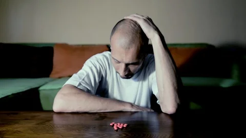 Depressed man suicidal depression commit suicide strong medicament drugs pills 스톡 동영상 111144711