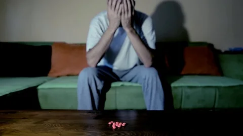 Depressed man suicidal depression commit suicide strong medicament drugs pills 스톡 동영상 111144730