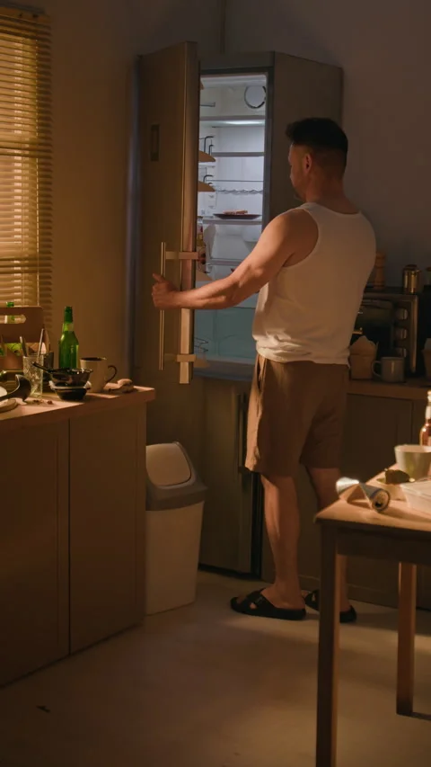 Depressed Middle Aged Man Taking Bottle of Beer from Refrigerator Stock Footage 344872853