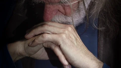 Depressed sad old man close his eyes looking at camera Stock Footage 74982379