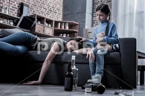Depressed unhappy girl holding her mothers head Stock Photos