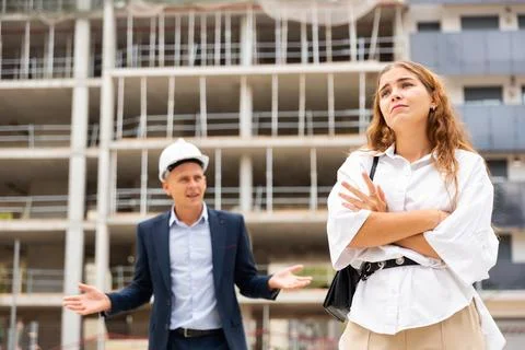 Depressed woman having problems at construction site 스톡 사진