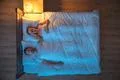 The depressed woman lay on the bed. evening night time. view from above Photo