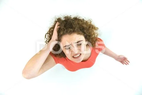 The depressed woman stand on the white background. View from above Stock Photos