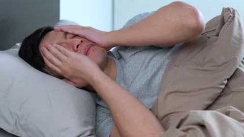Depressed young Asian man cannot sleep from insomnia Video stock 156638067