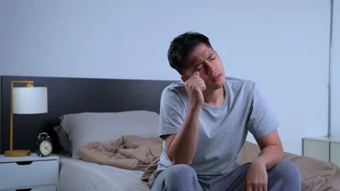 Depressed young Asian man cannot sleep from insomnia Видео 156638393