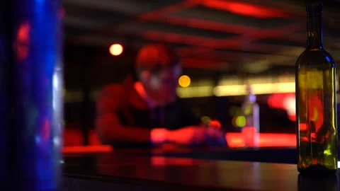 Depressed young man drinking alcohol alone in bar, failure, problems in life Stock Footage 89840041