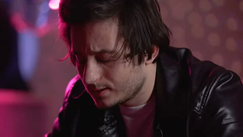 Depressed young man snorting coke powder in night club, drug abuse problem Stock Footage 105136536