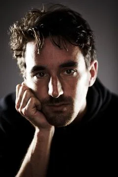 Depression can affect anyone. Portrait of a young man looking depressed. Stock Photos