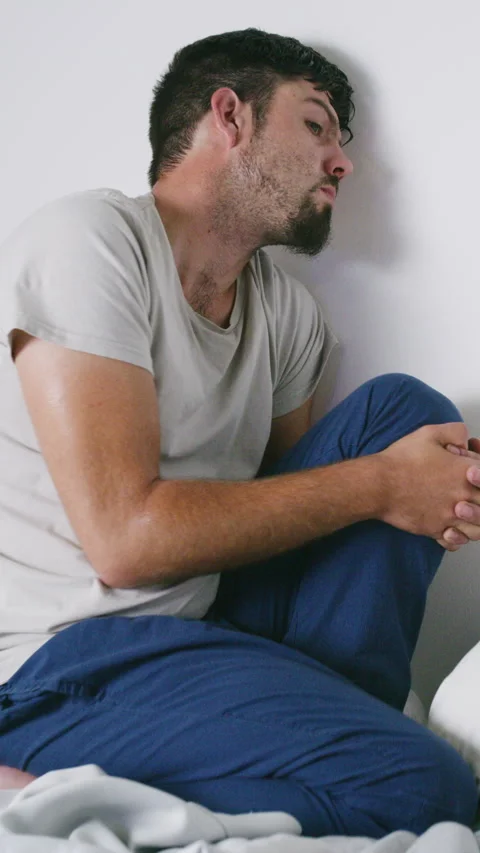 Depression, scared and man in home with panic attack, bad news and emotional Stock Footage 324132574