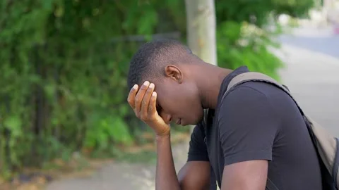 Depression, solitude -sad black man is desperate holding his head with his hands Stock Footage 143242527