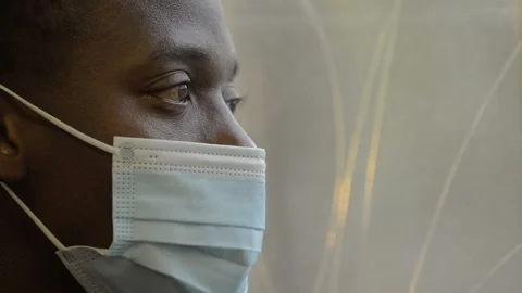 Depression, thoughts - black man with mask on the bus thinking - macro Video stock 146788796