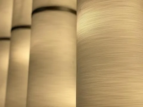 Dept of field of a beige rolled patterns, abstract background Stock Photos