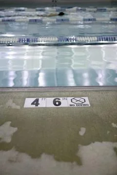 Depth restriction warning on a swimming pool Stock Photos