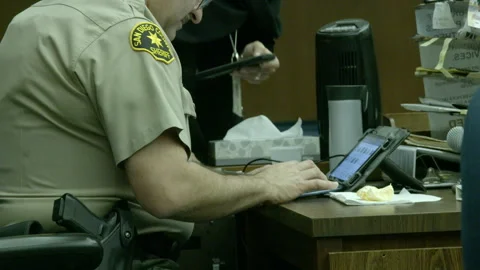 Deputy Sheriff Working on Tablet at Desk 库存影片 343963603