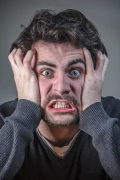 Deranged angry young man Stock Photos