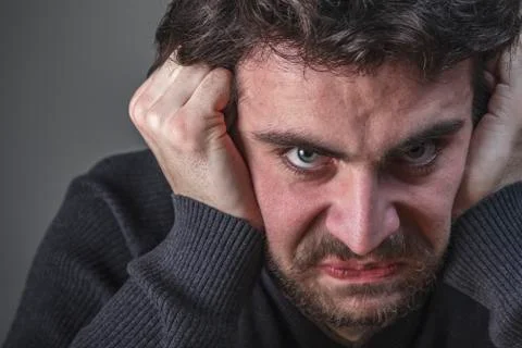 Deranged angry young man Stock Photos