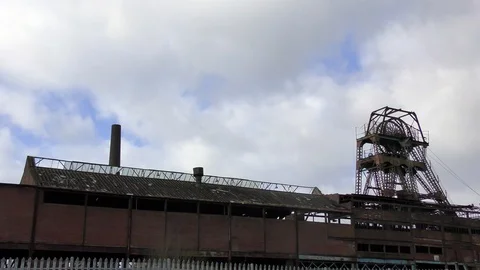 Derelict abandoned coal mine pit moody panning shot Stock Footage 85898118