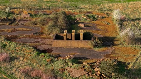 Derelict wartime concrete structure with exposed walls and collapsed fragments Vídeos de archivo 334846715