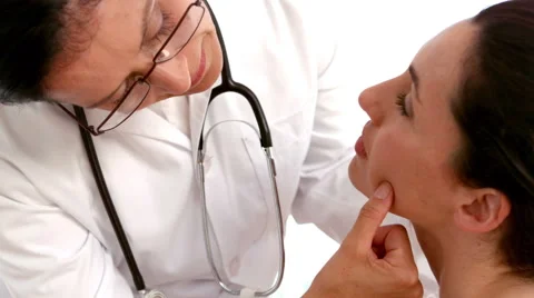 Dermatologist examining a patients face Stock Footage