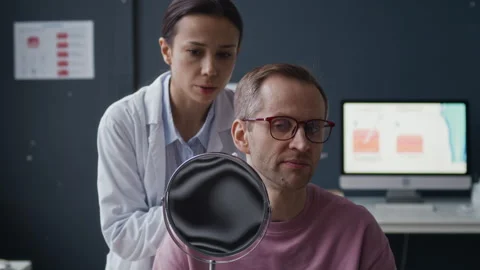 Dermatologist Explaining Treatment Plan during Clinic Consultation Stock Footage 329742273