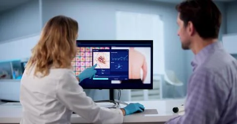 Dermatologist Performs Digital Skin Screening For Melanoma Using High-tech De Stock Photos