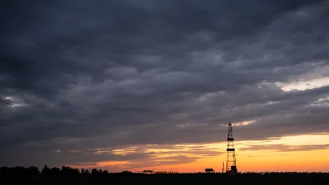 The derrick against the background of the cloudly evening dark sky. Stock Footage 160492197