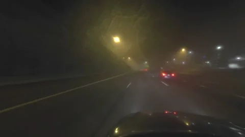 (Desaturated) Timelapse of Car Driving Through Fog on a Freeway Stock Footage 265685541