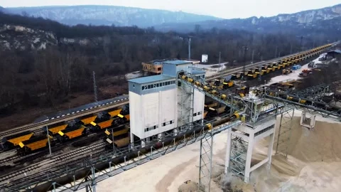 Descend Orbit inside Aged Coal Plant Railroad Transport Zoom Out Reveal Scale Stock Footage 274132318