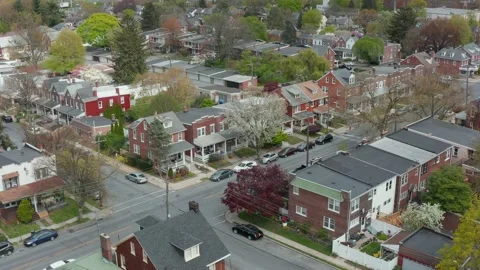 Descending aerial establishing shot of homes in city. Pedestal shot. Stock Footage 154236712
