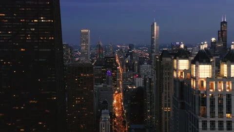 Descending aerial shot of Chicago downtown skyline in night illumination, USA 4K Stock Footage